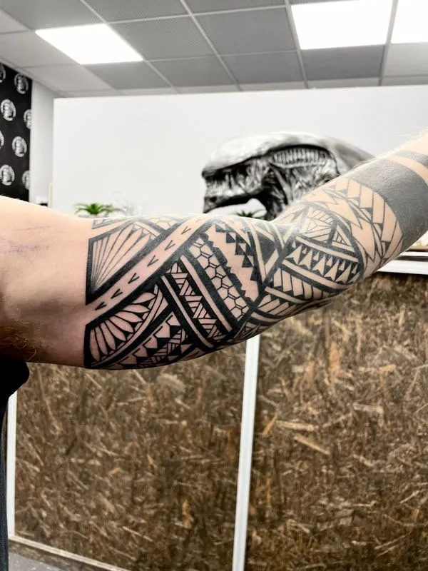 Polynesian tribal sleeve tattoo